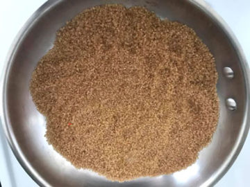 demerara cane sugar leveled in the stainless steel pan