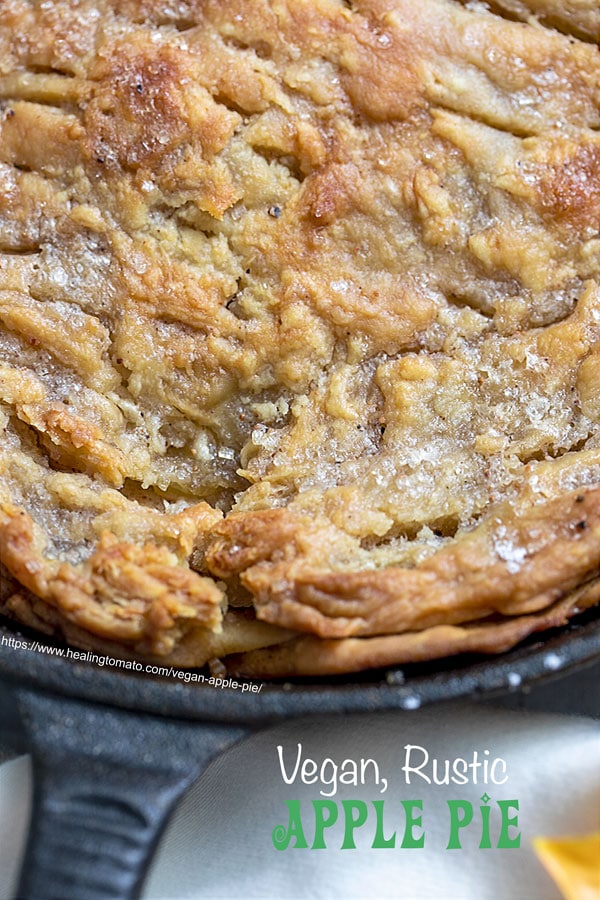 cloeseup view of a baked apple pie in a cast iron pan