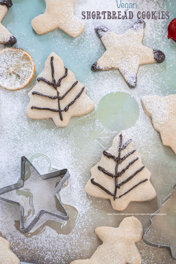 Top view of Christmas tree shaped cookies with a little bit of chocolate icing - Best Vegan Cookies