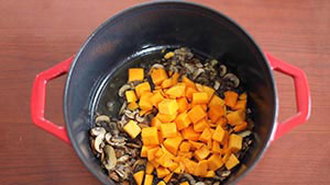 cubed butternut squash added to the dutch oven
