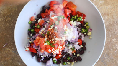 Salt being sprinkled over the grey bowl