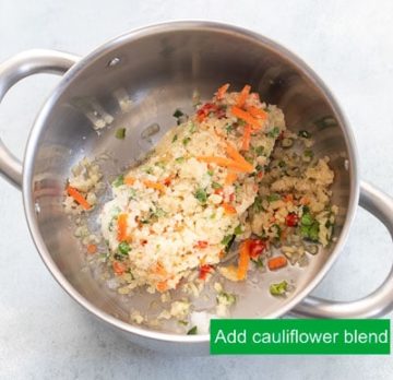 Top view of frozen riced cauliflower blend in a stainless steel sauce pan