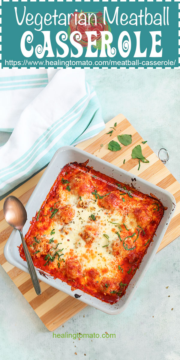 Top view of the meatball casserole in a grey casserole dish over a chopping board.