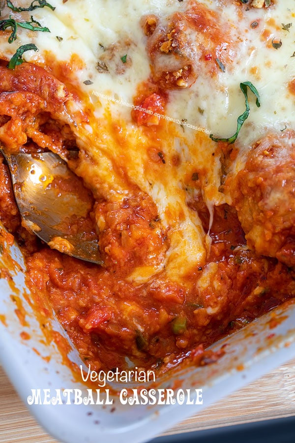 Top and closeup view of part of the sauce and melted cheese in the meatball casserole
