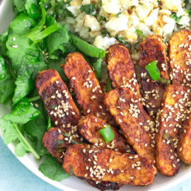 Top and closeup view of tempeh with sesame seeds sprinkled as garnish