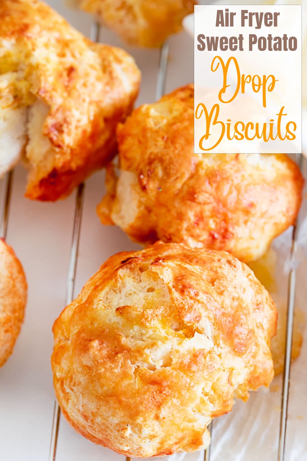 Top, closeup view of the biscuits on a wire rack