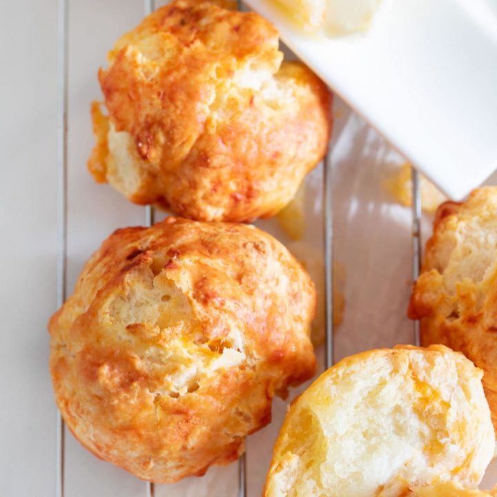 Top, closeup view of the biscuits on a wire rack