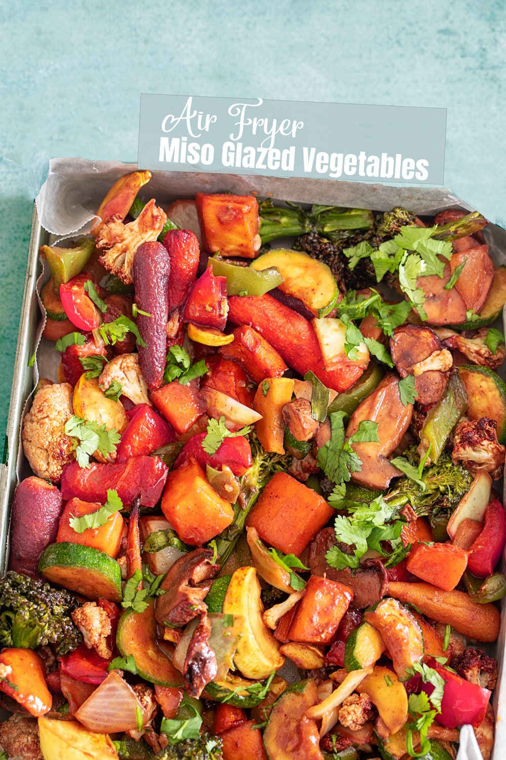 Top and closeup view of the air fryer miso glazed vegetables