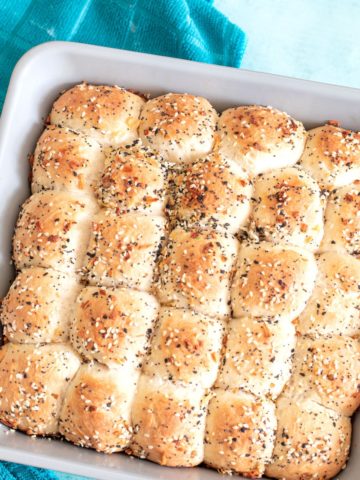 Top view of the vegan dinner rolls in a grey baking dish
