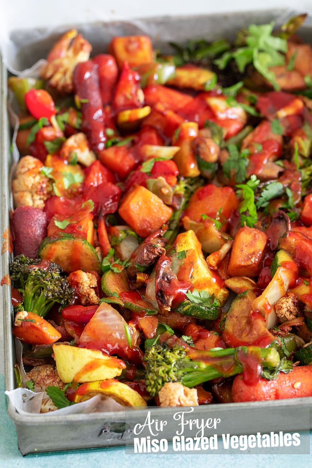 Top and angle view of the air fryer miso glazed vegetables