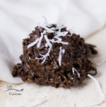 Front view of chocolate cookies with shredded coconut as garnish