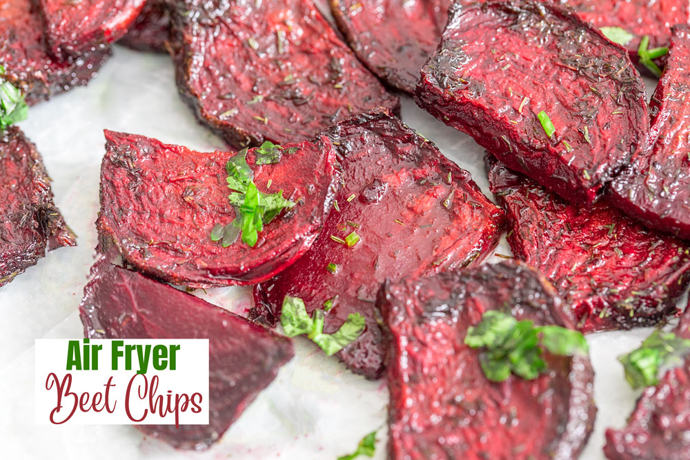 closeup view of air fryer beet chips on a white wax paper
