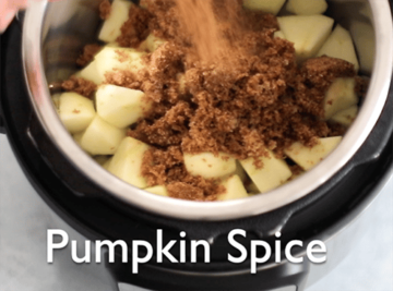 The author adding pumpkin pie spice to the Instant Pot