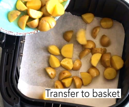 Chopped potatoes being transferred to basket. Lebanese potato salad
