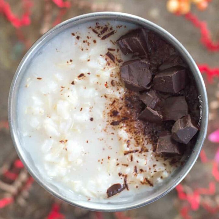 Top view and closeup of a silver cup filled with brown rice and garnished with chocolate cubes