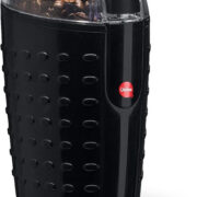 A black base coffee grinder with a clear top where you can see the coffee beans