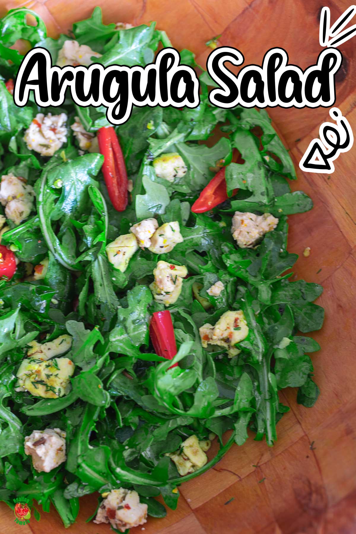 Top view of arugula salad in a brown salad bowl.