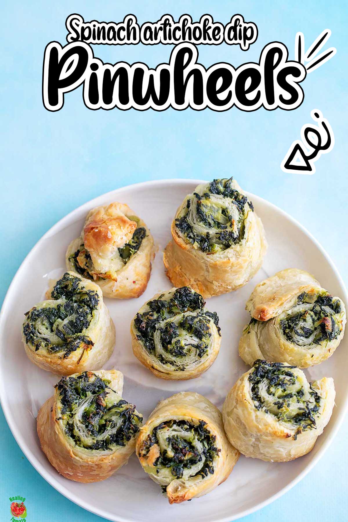 Top view of 8 puff pastry pinwheels on a white plate and a blue background
