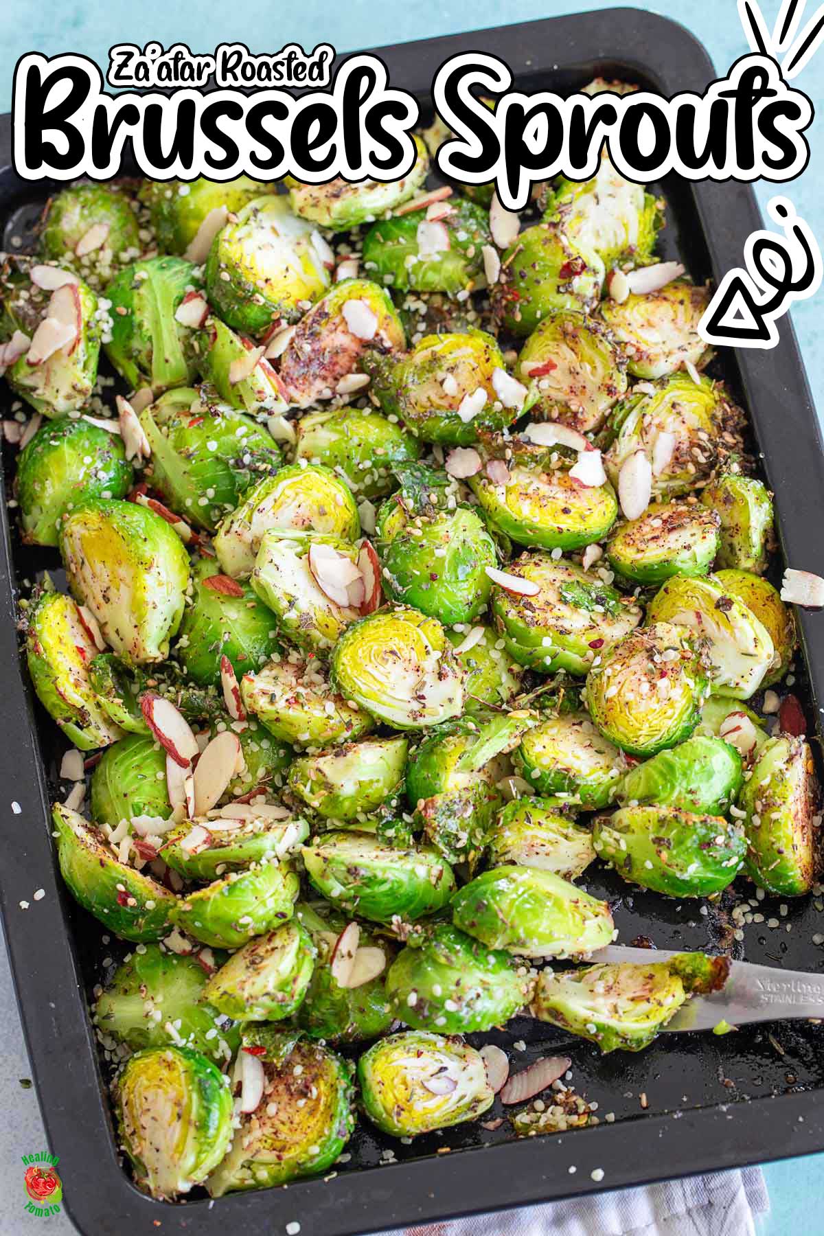 top view of roasted sprouts in a black sheet pan