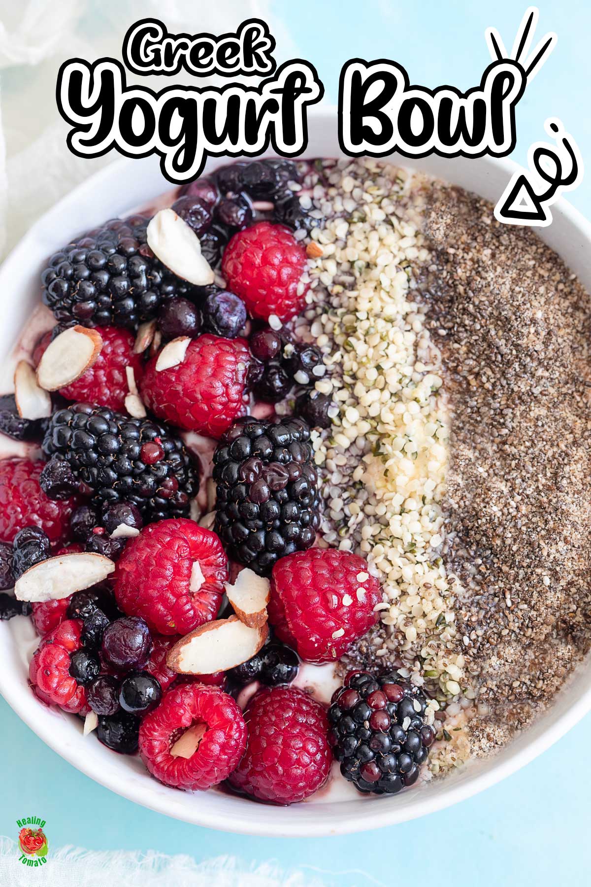 Closeup of the breakfast bowl that shows the berries, seeds and almonds.