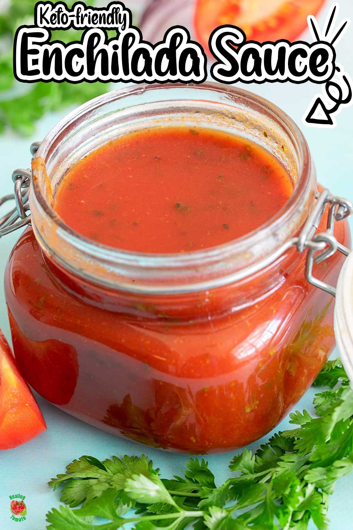 Front view of a glass jar filled with red enchilada sauce. Their is cilantro bunch in front of the jar.