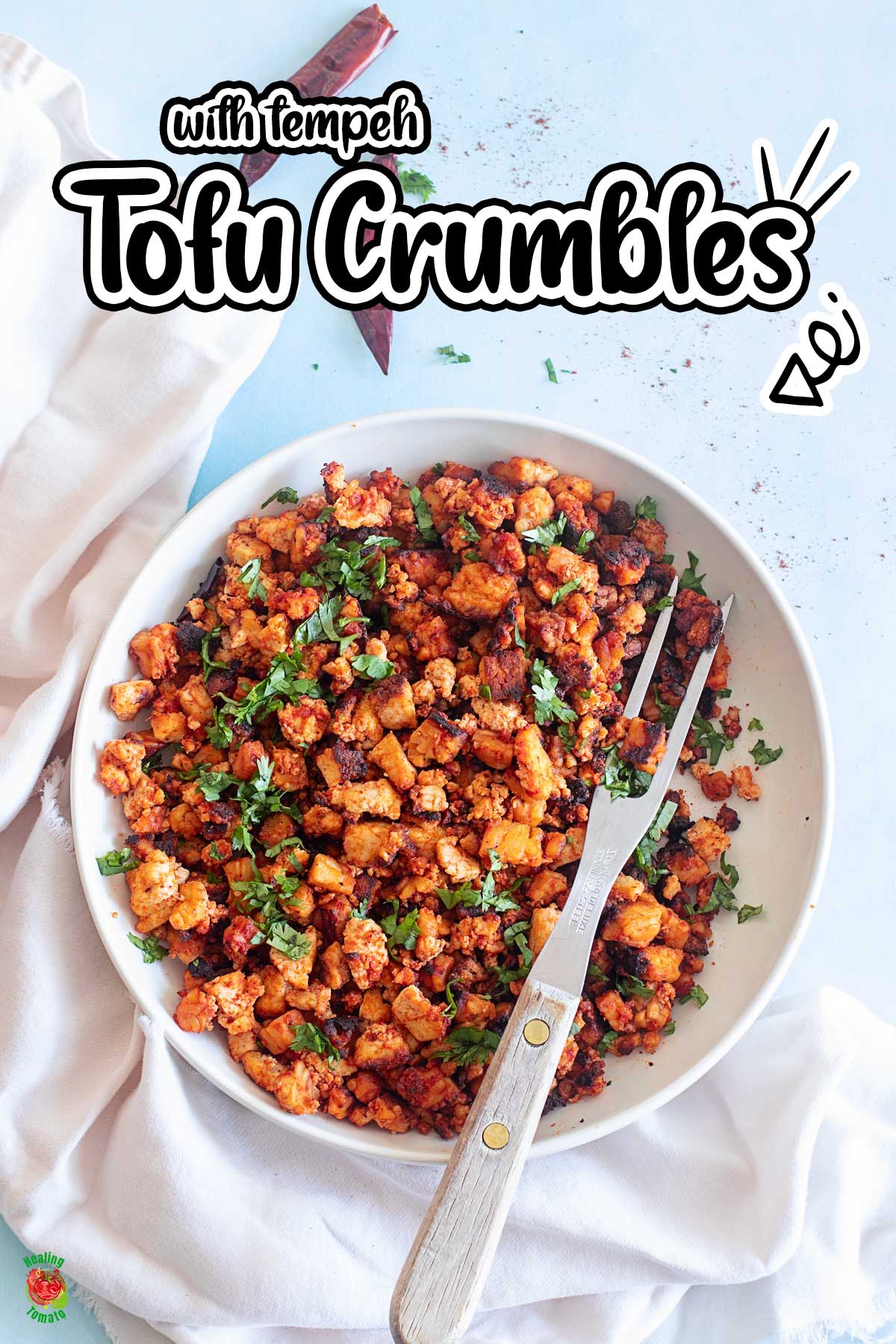 Top and closeup view of a white bowl filled with the tofu tempeh crumbles and a grilling fork on the side.
