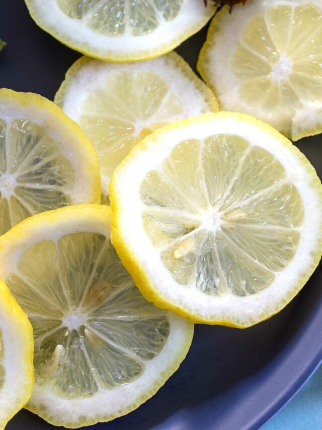 Top and closeup view of lemon slices on a blue plate