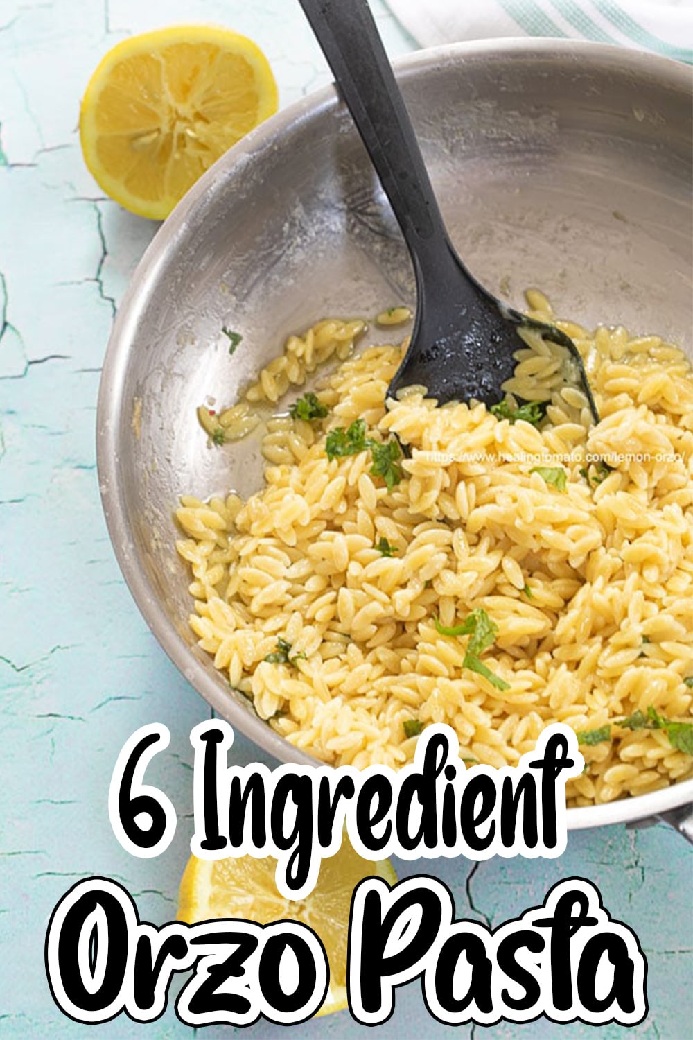 Top view of a stainless steel skillet filled with orzo pasta salad. Savory lemon recipes