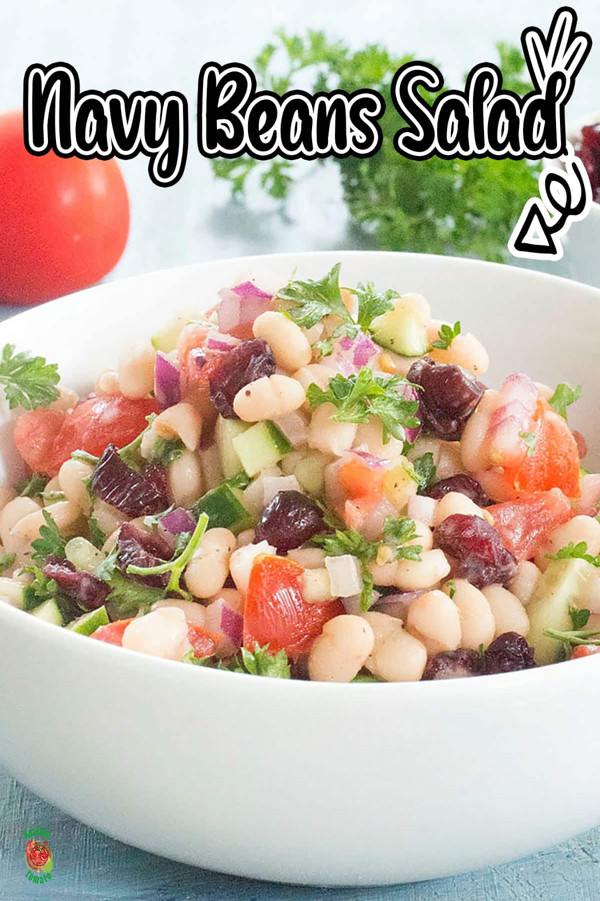 Front view of a white bowl filled with navy beans salad