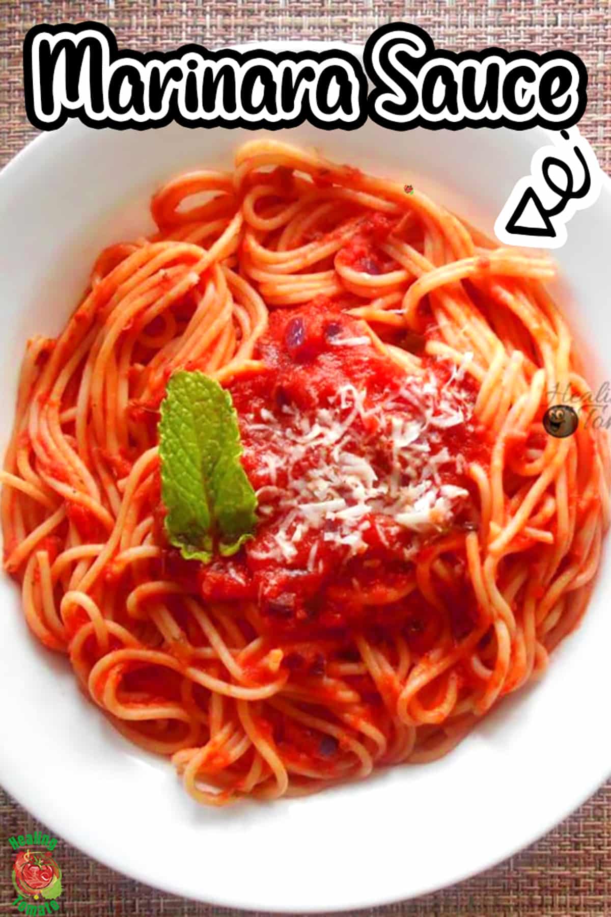 Top view of a white plate filled with spaghetti and campari tomato sauce recipe