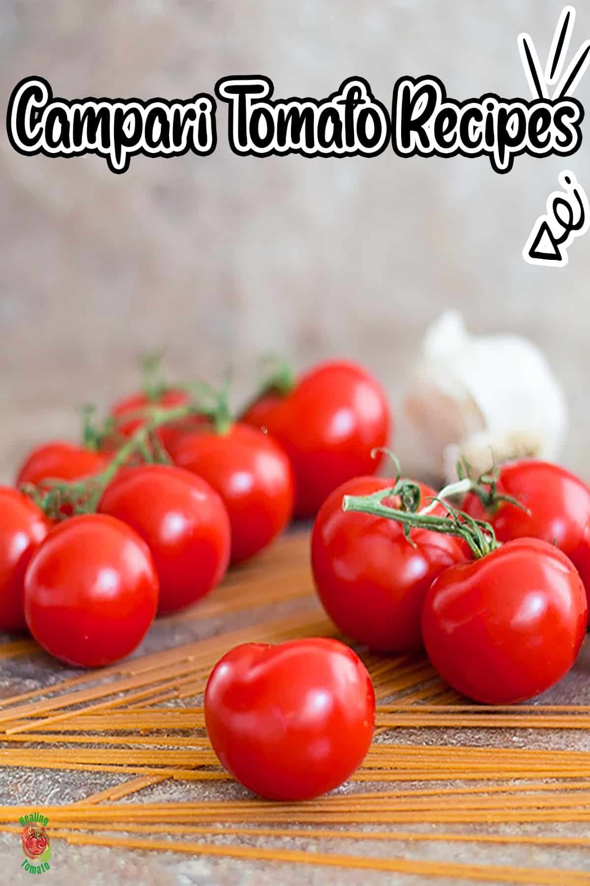 Front view of one campari tomato sitting on a few uncooked spaghetti strands. More campari tomatoes in the background