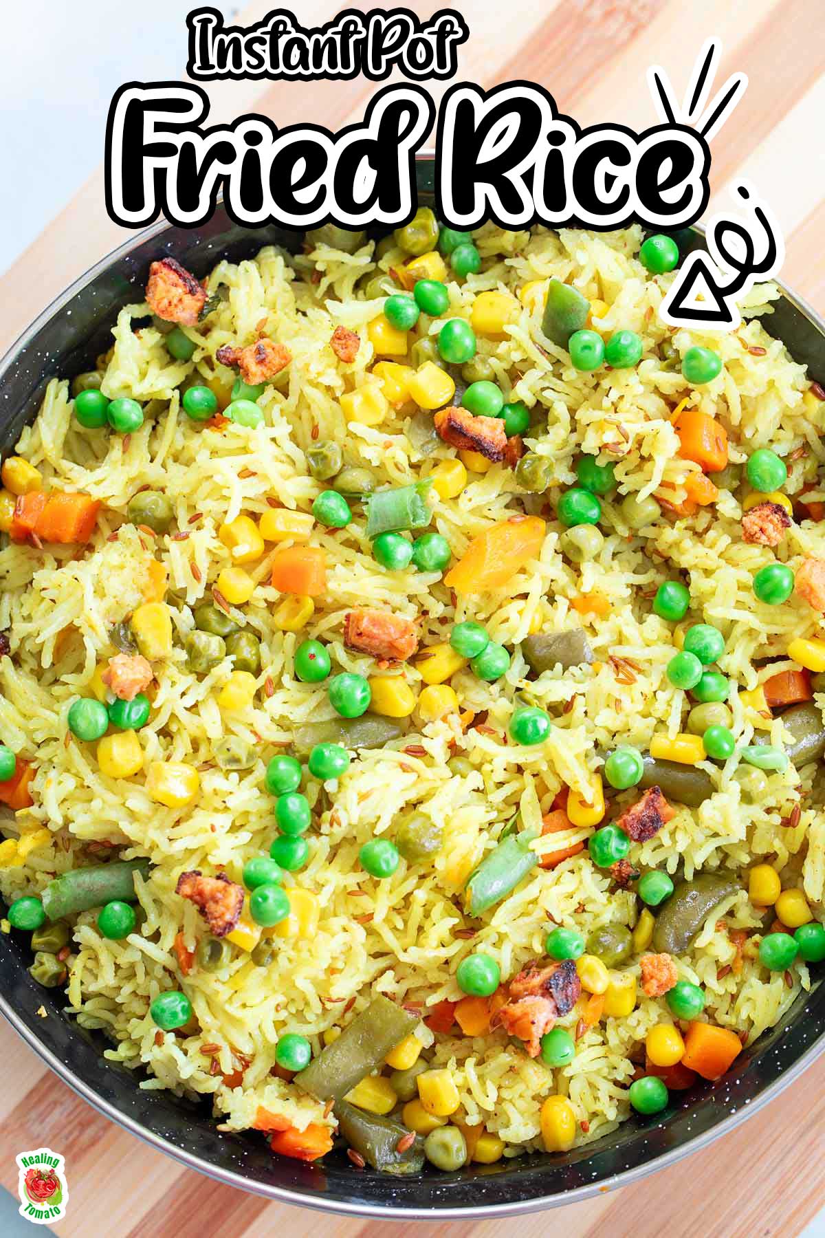 Closeup view of rice and veggies in a black pan