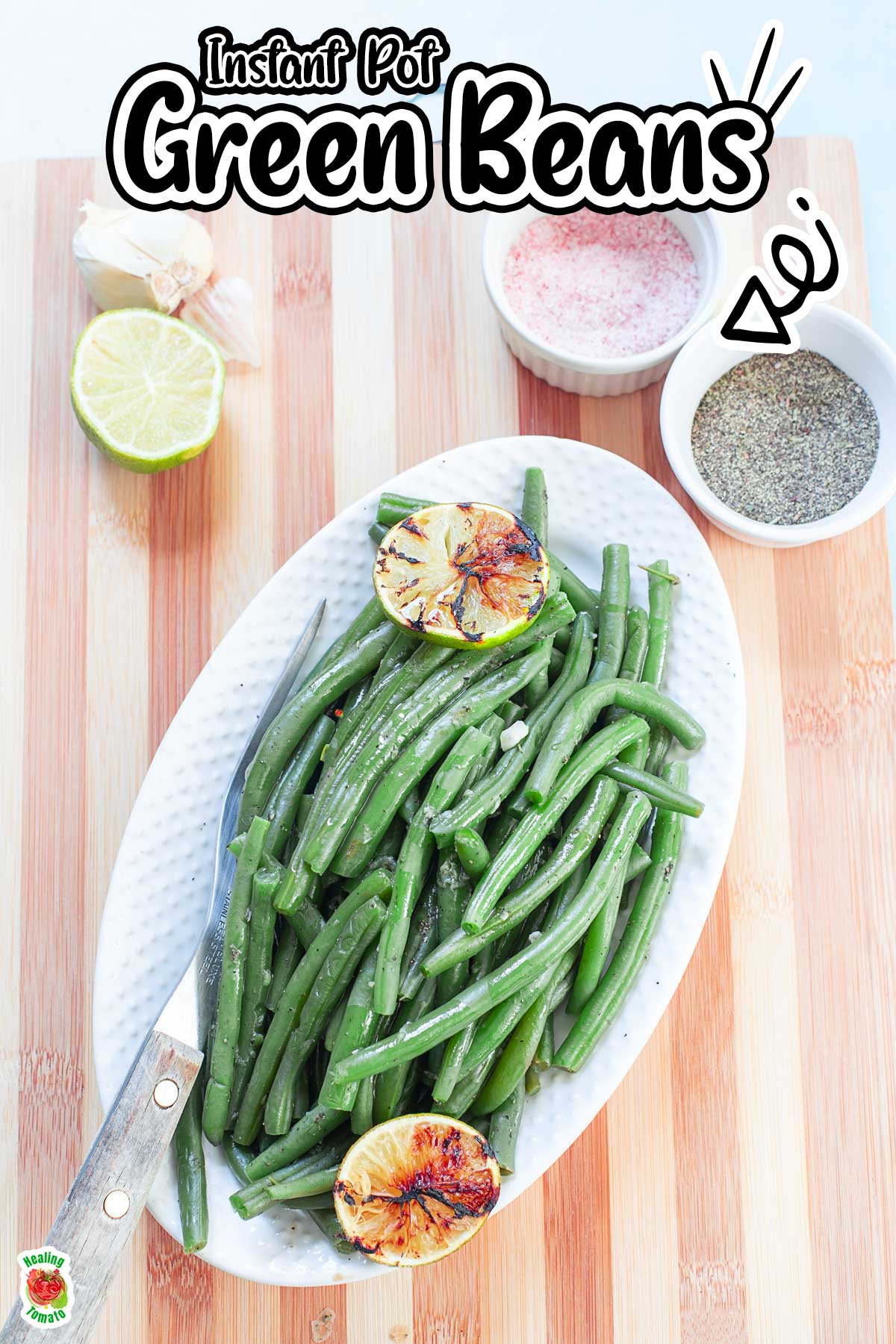 Top of green beans in a white serving dish placed on a brown cutting board